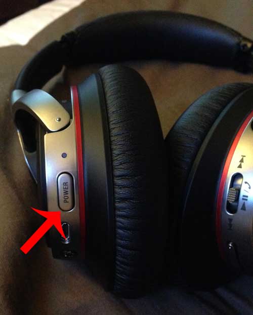 touch and hold the power button on the headphones