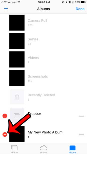 tap the red circle next to album to delete