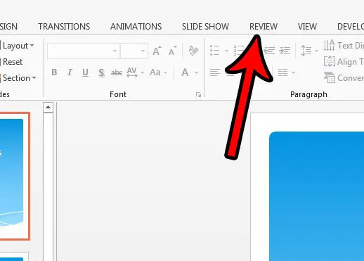 click the powerpoint 2013 review tab