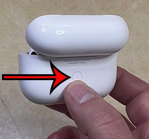 press and hold the button on the back of the AirPods